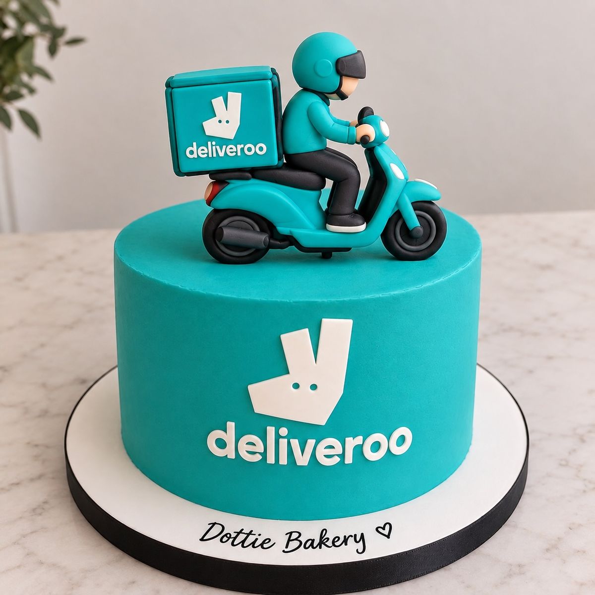 Teal corporate cake with a hand-modelled delivery rider and scooter on top